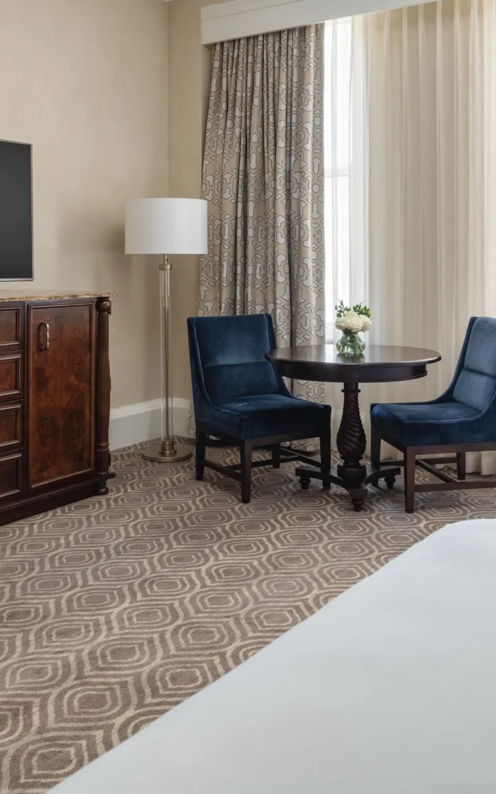 Television And Sitting Area In A Queen Superior Guestroom